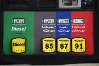 Prices are displayed above the different grades of gasoline available to motorists, Thursday, May 27, 2021, near Cheyenne, Wyo. After a brief dip, gas prices in the U.S. are on the rise again, up 2.5 cents per gallon from last week to $3.09 per gallon, according to the travel and fuel price tracking app GasBuddy. On Monday, June 28, 2021 West Texas Intermediate crude fell $1.14 to $72.91 per barrel, but the price is still up 50% on the year. (AP Photo/David Zalubowski)