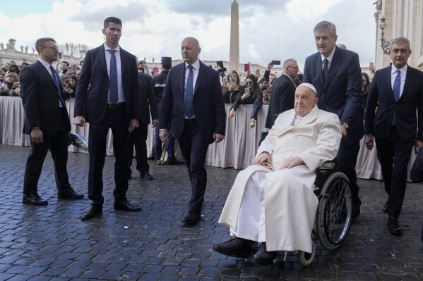 Pope Francis leaves at the end of his weekly general audience in St. Peter's Square at the Vatican, Wednesday, March 6, 2024. (AP Photo/Gregorio Borgia)