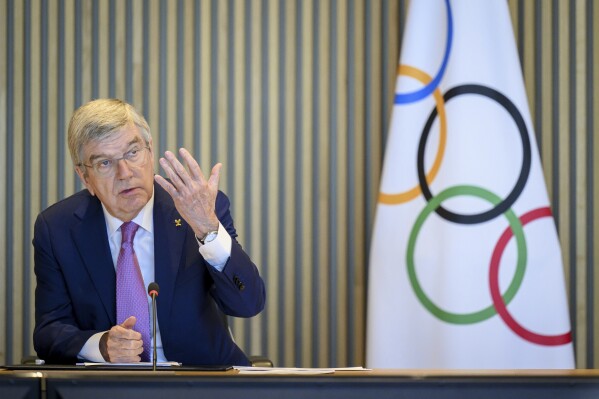 International Olympic Committee (IOC) President Thomas Bach speaks at the opening of the executive board meeting of the International Olympic Committee (IOC), at the Olympic House, in Lausanne, Switzerland, Tuesday, March 19, 2024. (Laurent Gillieron/Keystone via AP)