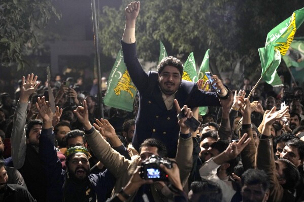 Supporters of Former Prime Minister Nawaz Sharif' party 'Pakistan Muslim League-N' dance to celebrate their party victory in the initial results of the country's parliamentary election, in Lahore, Pakistan, Friday, Feb. 9, 2024. (APPhoto/K.M. Chaudary)