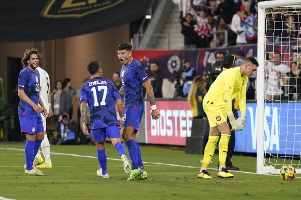 United States forward Brandon Vazquez, center, celebrates after scoring against Serbia goalkeeper Dorde Petrović, right, during the first half of an international friendly soccer match in Los Angeles, Wednesday, Jan. 25, 2023. (AP Photo/Ashley Landis)
