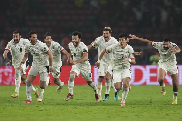 Egypt's Mohamed Salah, center, and teammates celebrate during the African Cup of Nations 2022 semifinal soccer match between Cameroon and Egypt at the Olembe stadium in Yaounde, Cameroon, Thursday, Feb. 3, 2022. (AP Photo/Themba Hadebe)