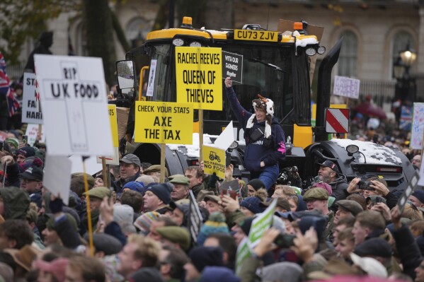 Farmers protest to urge the government to change course over its inheritance tax plans, in London, Tuesday, Nov. 19, 2024. (AP Photo/Kin Cheung)
