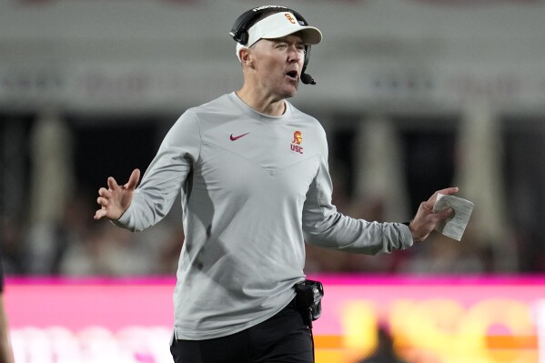 Southern California head coach Lincoln Riley argues a call during the second half of an NCAA college football game against Washington Saturday, Nov. 4, 2023, in Los Angeles. (AP Photo/Marcio Jose Sanchez)