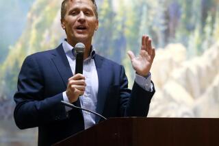 FILE - Former Missouri Gov. Eric Greitens and 2022 U.S. Senate candidate speaks at the Taney County Lincoln Day event April 17, 2021, at the Chateau on the Lake in Branson, Mo. Greitens is banking on Republican voters forgiving his past indiscretions when they choose a U.S. Senate nominee next August. (Nathan Papes/The Springfield News-Leader via AP)