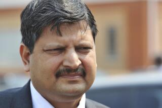 FILE - Atul Gupta, of the Gupta family, is seen outside magistrates courts in Johannesburg, Sept. 2010. Dubai police said Tuesday, June 7, 2022, that they have arrested two brothers, Atul and Rajesh from the Gupta family wanted in connection with a corruption case involving former South African President Jacob Zuma, the latest high-profile extradition case involving the United Arab Emirates. (AP Photo)