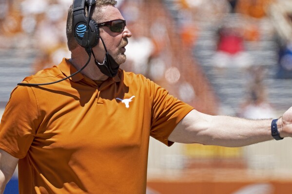 FILE - Texas co-defensive coordinator Jeff Choate watches his team during the final half of the Texas Orange and White Spring Scrimmage in Austin, Texas, April 24, 2021. Nevada has named Choate its new head football coach, the school announced Monday, Dec. 4, 2023. (AP Photo/Michael Thomas, File)