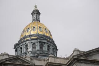 FILE - The gold dome of the Colorado State Capitol on March 23, 2023, in Denver. In Colorado, House lawmakers approved a measure Wednesday, April 12, that would lower the maximum interest rate for medical debt to 3%, require greater transparency in costs of treatment and prohibit debt collection during an appeals process. (AP Photo/David Zalubowski, File)