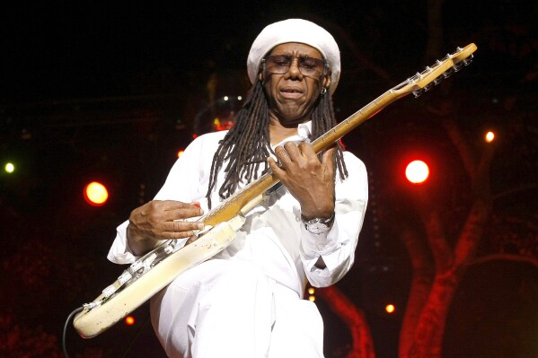 FILE - Guitarist Nile Rodgers of Chic performs at the Jazz Festival of 5 Continents, in Marseille, southern France, July 20, 2013. Rodgers, American songwriter and co-founder of the influential 1970s disco band Chic and esteemed Finnish classical music composer and conductor Esa-Pekka Salonen have won the 2024 Polar Music Prize, a Swedish music award, the award panel announced Tuesday, March 12, 2024. (AP Photo/Claude Paris, file)