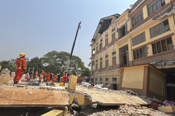 Rescuers work at U Hla Thein Buddhist monastery that collapsed in Friday's earthquake in Mandalay, Myanmar, Monday, March 31, 2025. (AP Photo)