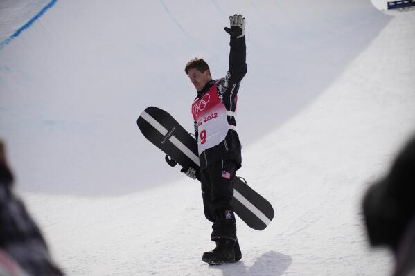United States' Shaun White waves in the halfpipe course after the men's halfpipe finals at the 2022 Winter Olympics, Friday, Feb. 11, 2022, in Zhangjiakou, China. (AP Photo/Francisco Seco)