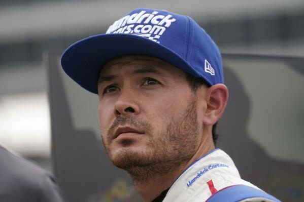Kyle Larson stands in pit row during qualifying for the NASCAR All-Star Race auto race at Texas Motor Speedway in Fort Worth, Texas, Saturday, May 21, 2022. (AP Photo/LM Otero)