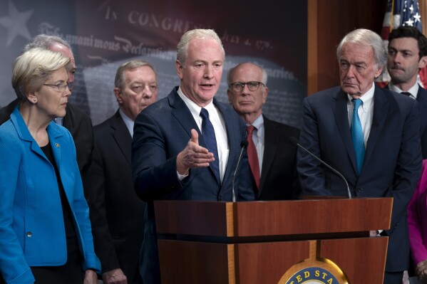 Sen. Chris Van Hollen, D-Md., center, is joined by fellow Democrats as they discuss a national security memorandum with the Biden administration aimed at ensuring all weapons acquired through U.S. security assistance is used in line with international law, including international humanitarian law, at the Capitol in Washington, Friday, Feb. 9, 2024. Van Hollen is joined by, from left, Sen. Elizabeth Warren, D-Mass., Sen. Dick Durbin, D-Ill., Sen. Peter Welch, D-Vt., Sen. Ed Markey, D-Mass., and Sen. Jon Ossoff, D-Ga. (AP Photo/J. Scott Applewhite)