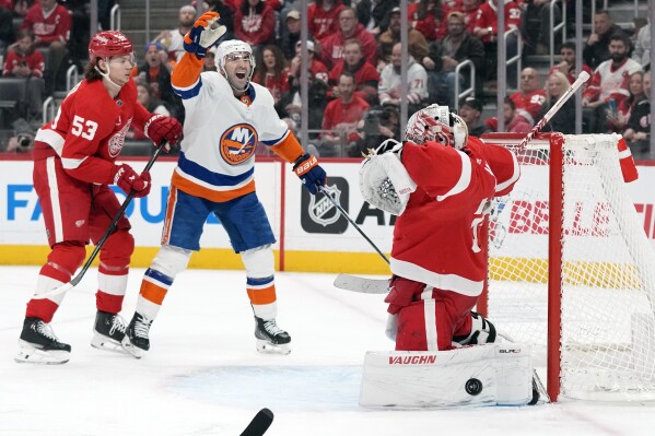 New York Islanders center Kyle Palmieri (21) reacts as the goal by teammate center Brock Nelson (29) bounces out of the net after a goal during the third period of an NHL hockey game, Thursday, Feb. 29, 2024, in Detroit. (AP Photo/Carlos Osorio)