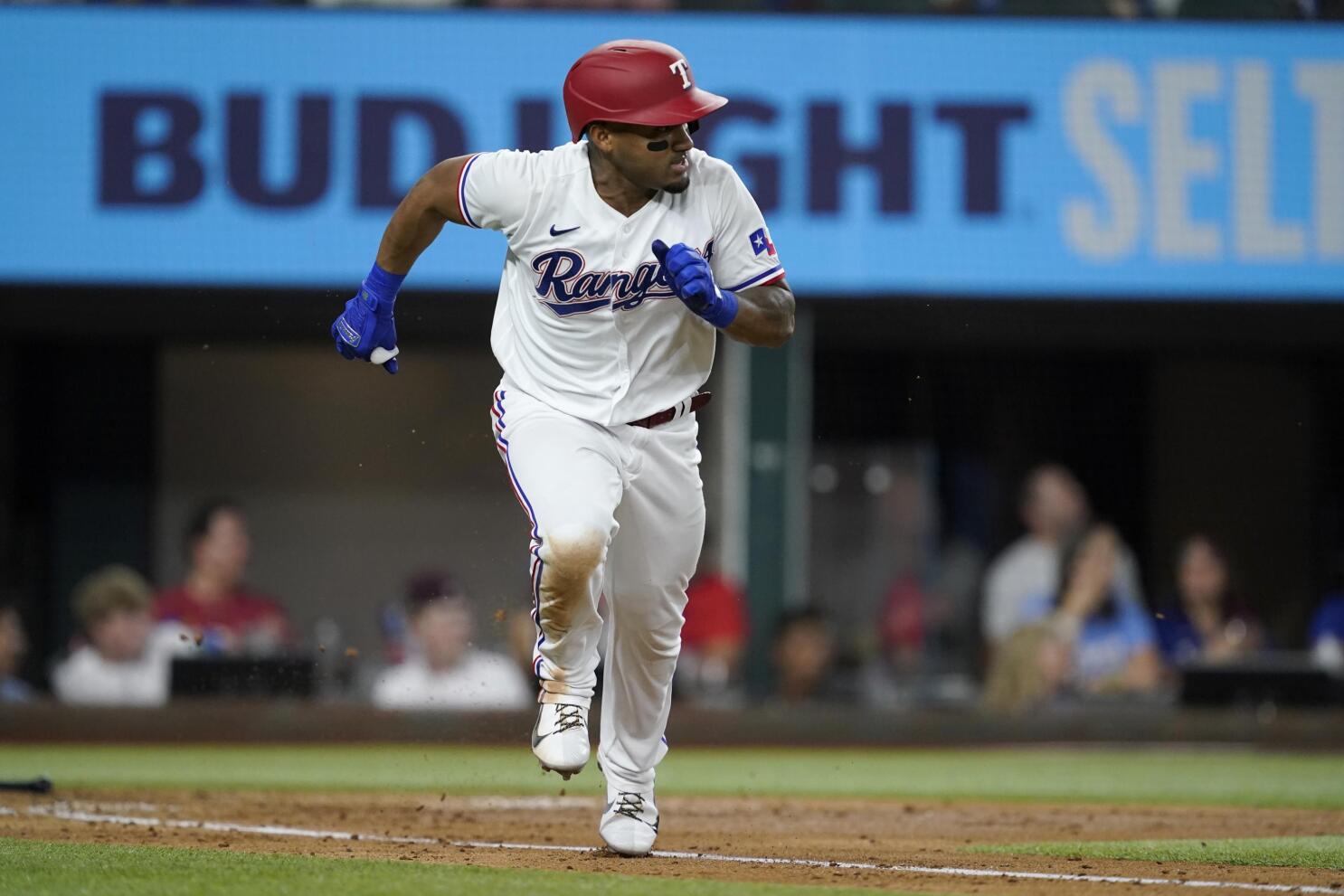 Rookies lead Rangers past Angels 5-2 to avoid 100th defeat