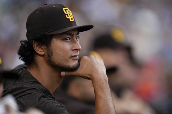 San Diego Padres pitcher Yu Darvish looks on from the dugout during the fifth inning of a baseball game against the San Francisco Giants, Saturday, Sept. 2, 2023, in San Diego. (AP Photo/Gregory Bull)