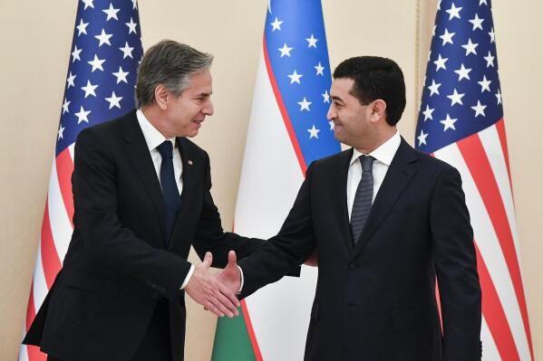 U.S. Secretary of State Antony Blinken, left, shakes hands with Uzbekistan Acting Foreign Minister Bakhtiyor Saidov during their meeting at the National Library in Tashkent, Uzbekistan, Wednesday, March 1, 2023. (AP Photo)