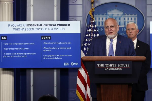 Dr. Robert Redfield, director of the Centers for Disease Control and Prevention, speaks as charts are displayed during a briefing about the coronavirus in the James Brady Press Briefing Room of the White House, Wednesday, April 8, 2020, in Washington, as Vice President Mike Pence listens. (AP Photo/Alex Brandon)