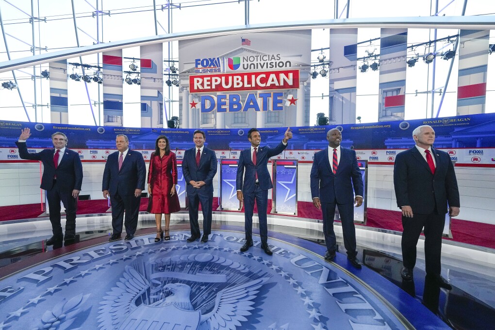 Republican presidential candidates, from left, North Dakota Gov. Doug Burgum, former New Jersey Gov. Chris Christie, former U.N. Ambassador Nikki Haley, Florida Gov. Ron DeSantis, entrepreneur Vivek Ramaswamy, Sen. Tim Scott, R-S.C., and former Vice President Mike Pence, before the start of a Republican presidential primary debate hosted by FOX Business Network and Univision, Wednesday, Sept. 27, 2023, at the Ronald Reagan Presidential Library in Simi Valley, Calif. (AP Photo/Mark Terrill)