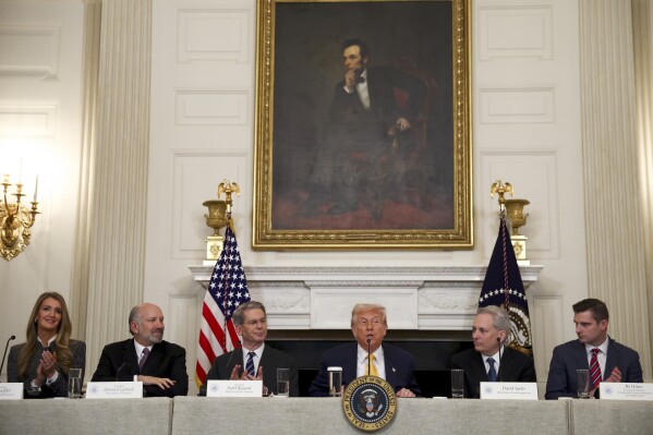 President Donald Trump speaks as administrator Kelly Loeffler, of the Small Business Administration, from left, Secretary of Commerce Howard Lutnick, Treasury Secretary Scott Bessent, White House AI and crypto czar David Sacks and Bo Hines, a member of the presidential council of advisers for digital assets, listen at the White House Crypto Summit in Washington, Friday, March 7, 2025. (Pool via AP)