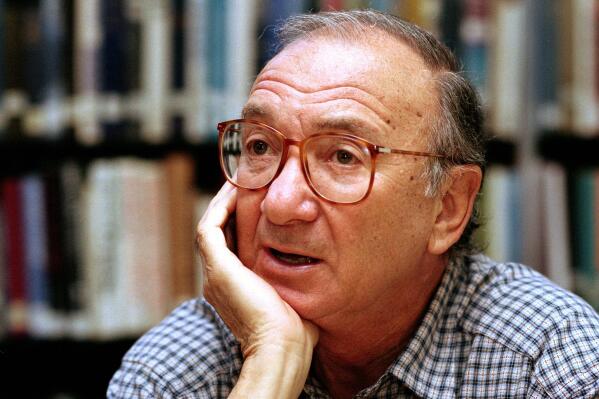 FILE- American playwright Neil Simon appears during an interview in Seattle, Wash., on Sept. 22, 1994. Dozens of notebooks, scripts, speeches, drafts of letters, artwork and even signed baseballs owned by the late playwright have been donated to the Library of Congress Simon, a master of comedy whose laugh-filled hits such as "The Odd Couple," "Barefoot in the Park" and his "Brighton Beach" trilogy dominated Broadway for decades, died on Aug. 26, 2018 at the age of 91. (AP Photo/Gary Stuart, File)