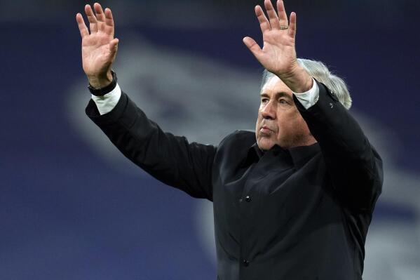 Real Madrid's head coach Carlo Ancelotti applauds the fans after the Spanish La Liga soccer match between Real Madrid and Real Sociedad at the Bernabeu stadium in Madrid, Spain, Saturday, March 5, 2022. Real Madrid won the match 4-1. (AP Photo/Manu Fernandez)