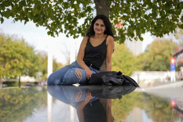 Turkish copywriter Serap Ilgin, 26, poses for a photograph at Taksim square in Istanbul, Turkey, Saturday, Nov. 4, 2023. (AP Photo/Francisco Seco)