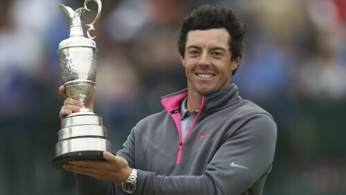 FILE - Rory McIlroy of Northern Ireland holds up the Claret Jug trophy after winning the British Open Golf championship at the Royal Liverpool golf club, Hoylake, England, July 20, 2014. Golf’s major championship season comes to a close at the British Open. It's the last chance of the year for Rory McIlroy to end his nine-year drought in the majors. At least the territory will be familiar. Royal Liverpool in Hoylake, England, is the site of the 151st edition of golf’s oldest championship, which begins Thursday, July 20. (AP Photo/Scott Heppell, File)