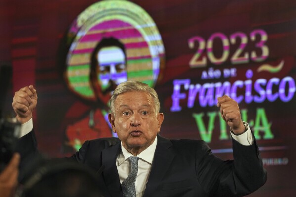 FILE - Mexican President Andres Manuel Lopez Obrador gives his regularly scheduled morning press conference, decorated with an image of Francisco "Pancho" Villa, a general in the Mexican Revolution, at the National Palace in Mexico City, Feb. 28, 2023. Mexico’s president praised Mexican revolutionary Francisco “Pancho” Villa on Tuesday, March 19, 2024, for his 1916 attack on Columbus, New Mexico, a raid that killed 18 Americans, mostly civilians. (AP Photo/Marco Ugarte, File)