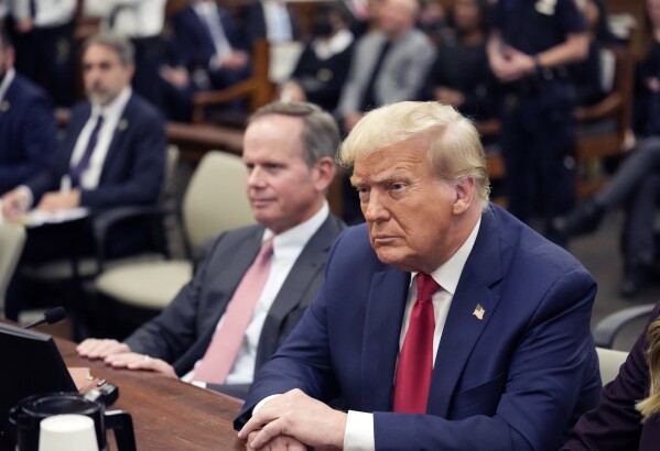 Former President Donald Trump sits in the courtroom with his legal team before the continuation of his civil business fraud trial at New York Supreme Court, Tuesday, Oct. 17, 2023, in New York. (AP Photo/Seth Wenig, Pool)