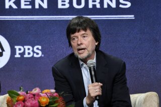 FILE - This July 29, 2019 file photo shows Ken Burns, director of the PBS documentary series "Country Music," speaking in a panel discussion during the 2019 Television Critics Association Summer Press Tour in Beverly Hills, Calif. Burns is inaugurating a new prize designed to promote historical films. Its first $200,000 grant will go to directors of “Flannery,” about the late Southern writer Flannery O’Connor. The author of “A Good Man is Hard to Find” suffered from lupus and died in 1964 at age 39. (Photo by Chris Pizzello/Invision/AP, File)