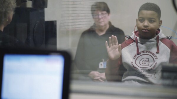 In this image from video provided by the Children’s Hospital of Philadelphia, an 11-year-old boy who was born with hereditary deafness is given a hearing test in Philadelphia, after he underwent a gene therapy procedure in October 2023. On Tuesday, Jan. 23, 2024, the hospital announced his hearing has improved enough that he now has only mild to moderate hearing loss in the ear that was treated, and is hearing sound for the first time in his life. (Children’s Hospital of Philadelphia via AP)