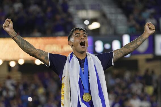 Orlando City's Facundo Torres celebrates in front of fans after Orlando City defeated Sacramento Republic in the U.S. Open Cup final soccer match Wednesday, Sept. 7, 2022, in Orlando, Fla. (AP Photo/John Raoux)
