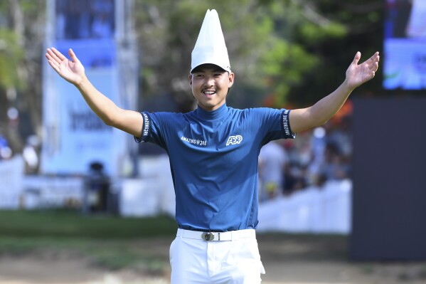 Australia's Min Woo Lee reacts on the 17th hole during the final round of the Australian PGA Championship in Brisbane, Sunday, Nov. 26, 2023. (Jono Searle/AAP Image via AP)