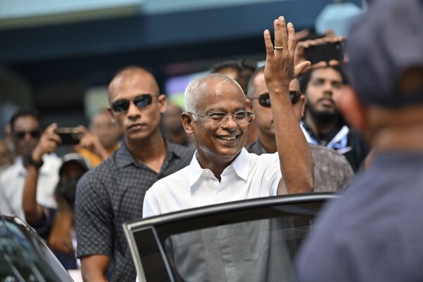 Maldives' incumbent President Ibrahim Mohamed Solih greets the crowd after casting his vote in Male, Maldives, Saturday, Sept. 30, 2023. Maldivians are voting in the runoff presidential election that has turned into a virtual referendum on which regional power, India or China, will have the biggest influence in the Indian Ocean archipelago nation. (AP Photo/Mohamed Sharuhaan)