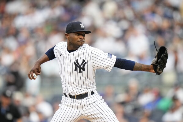 FILE - New York Yankees' Domingo German pitches during the first inning of a baseball game against the New York Mets Tuesday, July 25, 2023, in New York. Domingo Germán became a free agent Monday, Nov. 6, when he refused an outright assignment to the minor leagues from the New York Yankees, five months after he pitched Major League Baseball's 24th perfect game and three months after he entered alcohol abuse treatment. (AP Photo/Frank Franklin II, File)