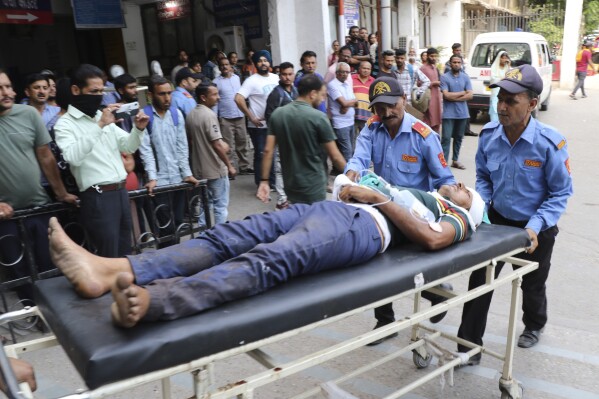 A man injured in a bus accident is brought to a hospital in Jammu, India, Thursday, May 30, 2024. The accident took place in the Jammu region on Thursday when a bus skidded off a highway and plunged 150 feet (45.7 meters) into a gorge, killing at least 21 people, government officials said. (AP Photo)