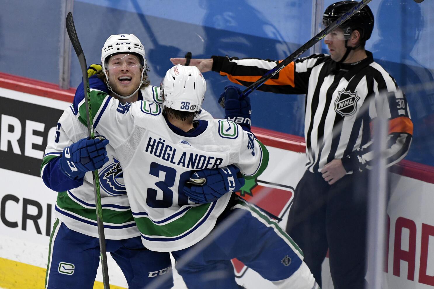 Wheeler helps Jets beat Canucks, clinch 3rd place in North - The