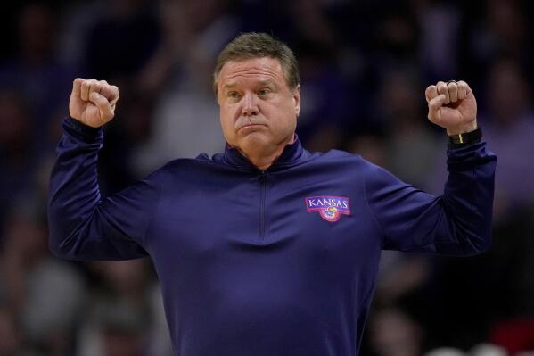 Kansas head coach Bill Self motions to his players during the second half of an NCAA college basketball game against Kansas State Tuesday, Jan. 17, 2023, in Manhattan, Kan. Kansas State won 83-82 in overtime. (AP Photo/Charlie Riedel)