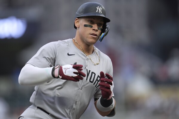 New York Yankees' Aaron Judge runs the bases after hitting a solo home run against the Minnesota Twins during the first inning of a baseball game Wednesday, May 15, 2024, in Minneapolis. (Ǻ Photo/Abbie Parr)