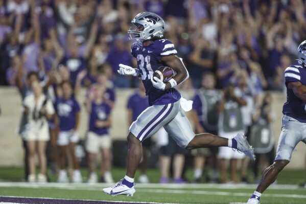 Kansas State running back DJ Giddens scores a touchdown during the first half of an NCAA college football game against Central Florida on Saturday, Sept. 23, 2023, in Manhattan, Kan. (AP Photo/Travis Heying)