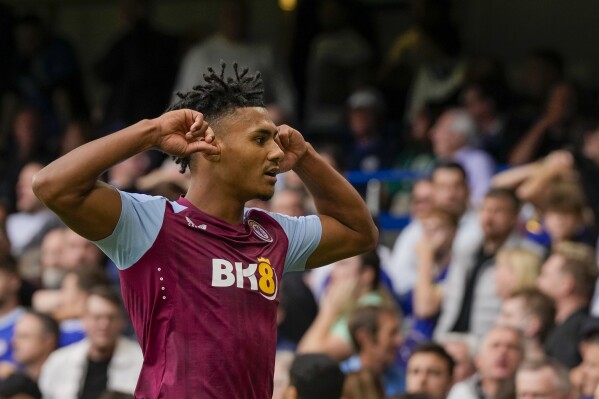 Aston Villa's Ollie Watkins celebrates after scoring his side's opening goal during the English Premier League soccer match between Chelsea and Aston Villa at Stamford Bridge stadium in London, Sunday, Sept. 24, 2023. (AP Photo/Alastair Grant)