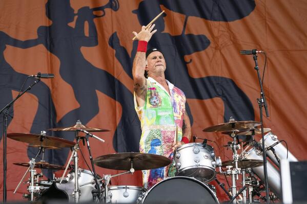 Chad Smith of the Red Hot Chili Peppers performs at the New Orleans Jazz and Heritage Festival, on Sunday, May 1, 2022, in New Orleans. (Photo by Amy Harris/Invision/AP)