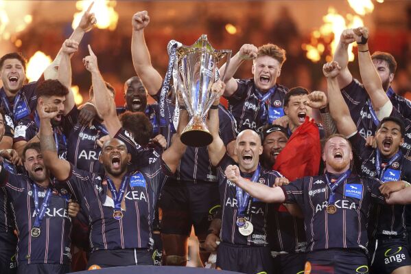Union Bordeaux-Begles lift the trophy after winning the Investec Champions Cup final between Northampton Saints and Bordeaux-Begles, at the Principality Stadium, Cardiff, Wales, Saturday May 24, 2025. (Adam Davy/PA via AP)