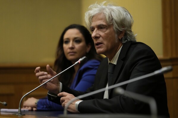 FILE - Pietro Orlandi, right, brother of Manuela, a 15-year-old daughter of a Vatican employee disappeared in 1983, is flanked by his lawyer Laura Sgro, left, as he attends a press conference on the establishing of a parliamentary investigative commission on Manuela Orlandi and other cold cases, in Rome, on Dec. 20, 2022. The Vatican on Wednesday July 12, 2023 sought to tamp down the latest tempest over the 1983 disappearance of a Vatican employee’s teen-age daughter, after Italian media claimed a new scoop in the investigation that the family immediately dismissed. (AP Photo/Alessandra Tarantino, File)
