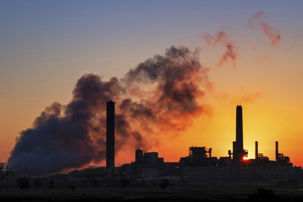 File - A coal-fired power plant is silhouetted against the morning sun on July 27, 2018, in Glenrock, Wyo. A climate philanthropy organization, Giving Green, received a $10 million anonymous donation in April, 2024, and thinks that the same donor may have given even more. (AP Photo/J. David Ake, File)