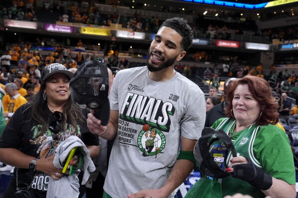 Boston Celtics forward Jayson Tatum celebrates after Game 4 of the NBA Eastern Conference basketball finals against the Indiana Pacers, Monday, May 27, 2024, in Indianapolis. The Celtics won 105-102.(AP Photo/Michael Conroy)