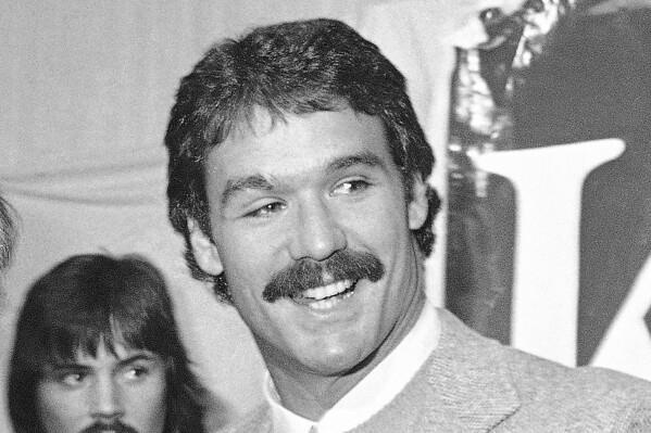 FILE - New England Patriots NFL football player Russ Francis smiles during a press conference Sunday, Feb. 11, 1980, at Boston Garden. Former NFL tight end Russ Francis, a three-time Pro Bowl selection with the New England Patriots who won a Super Bowl with the 1984 San Francisco 49ers, was killed along with another aviation enthusiast when the single-engine plane the two men were in crashed shortly after takeoff from an airport in upstate New York, authorities said Monday, Oct. 2, 2023. Francis was president of Lake Placid Airways, which runs charter and scenic flights. (AP Photo/File)
