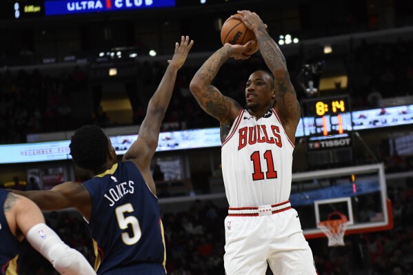 Chicago Bulls' DeMar DeRozan (11) goes up for a shot against New Orleans Pelicans' Herb Jones (5) during the first half of an NBA basketball game Saturday, Dec. 2, 2023, in Chicago. (AP Photo/Paul Beaty)