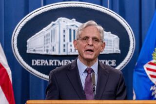FILE - Attorney General Merrick Garland speaks at a news conference at the Justice Department in Washington, on Nov. 8, 2021. The Department of Justice has sued Texas over new redistricting maps, saying the plans discriminate against voters in the state's booming Latino and Black populations. The maps passed by Texas' Republican-dominated Legislature favor incumbents and decrease political representation for growing minority communities that have driven growth in the nation’s largest red state.  (AP Photo/Andrew Harnik, File)